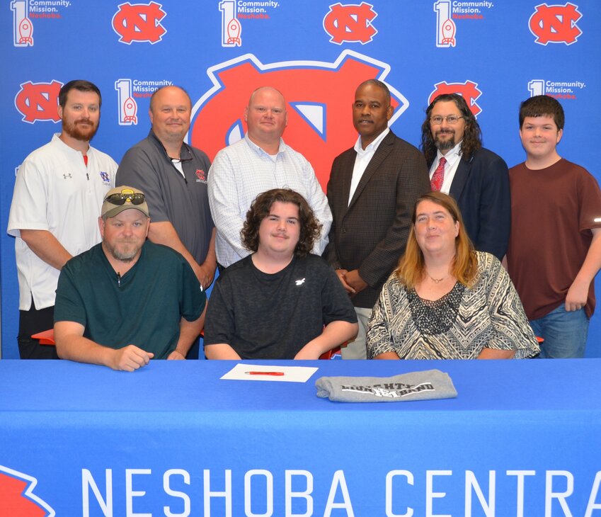 Neshoba Central’s Blake Kennedy signed with East Mississippi Community College to further his education and be a member of the EMCC Band. Pictured, front row from left, are his father James Kennedy, Blake Kennedy and his mother Heather Kennedy (Back) Assistant Principal Jonathan Walker, Principal Jason Gentry, Assistant Principal Brent Pouncy Assistant Principal LaShon Horne, Band Director Daniel Wade, and his brother Dylan Kennedy.
